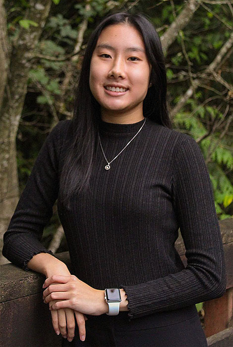 Female-presenting, Asian-American business scholarship recipient.